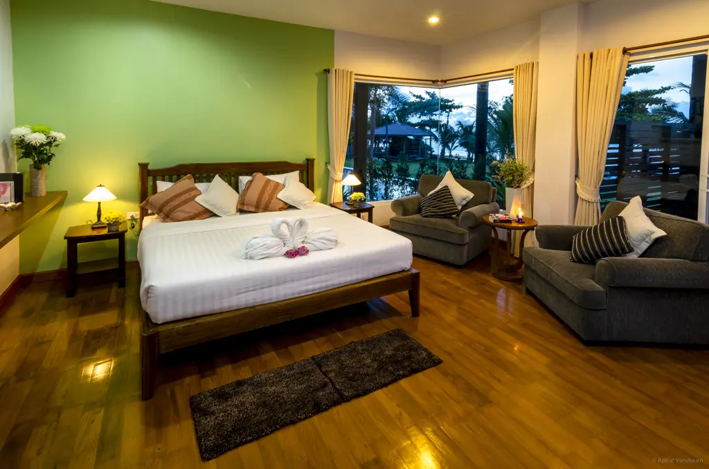 Nah Talay room with double bed, sofa and large windows